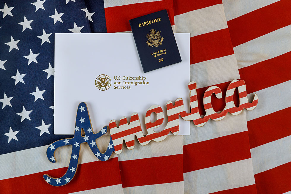 Letter from U.S. Citizenship and Immigration Services with a passport and U.S. flag.